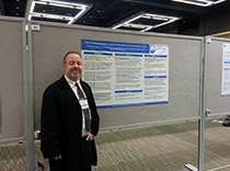 Dr. Robert Trobliger with poster of stress coping in epilepsy