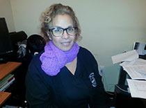 Dr. Lizardo wears her purple scarf proudly