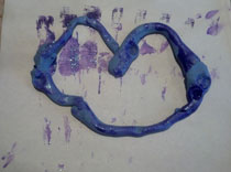 Play doh and purple paint make this heart